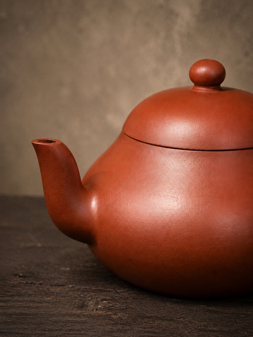 Aili teapot, close-up of the tall spout, domed lid, and rounded body