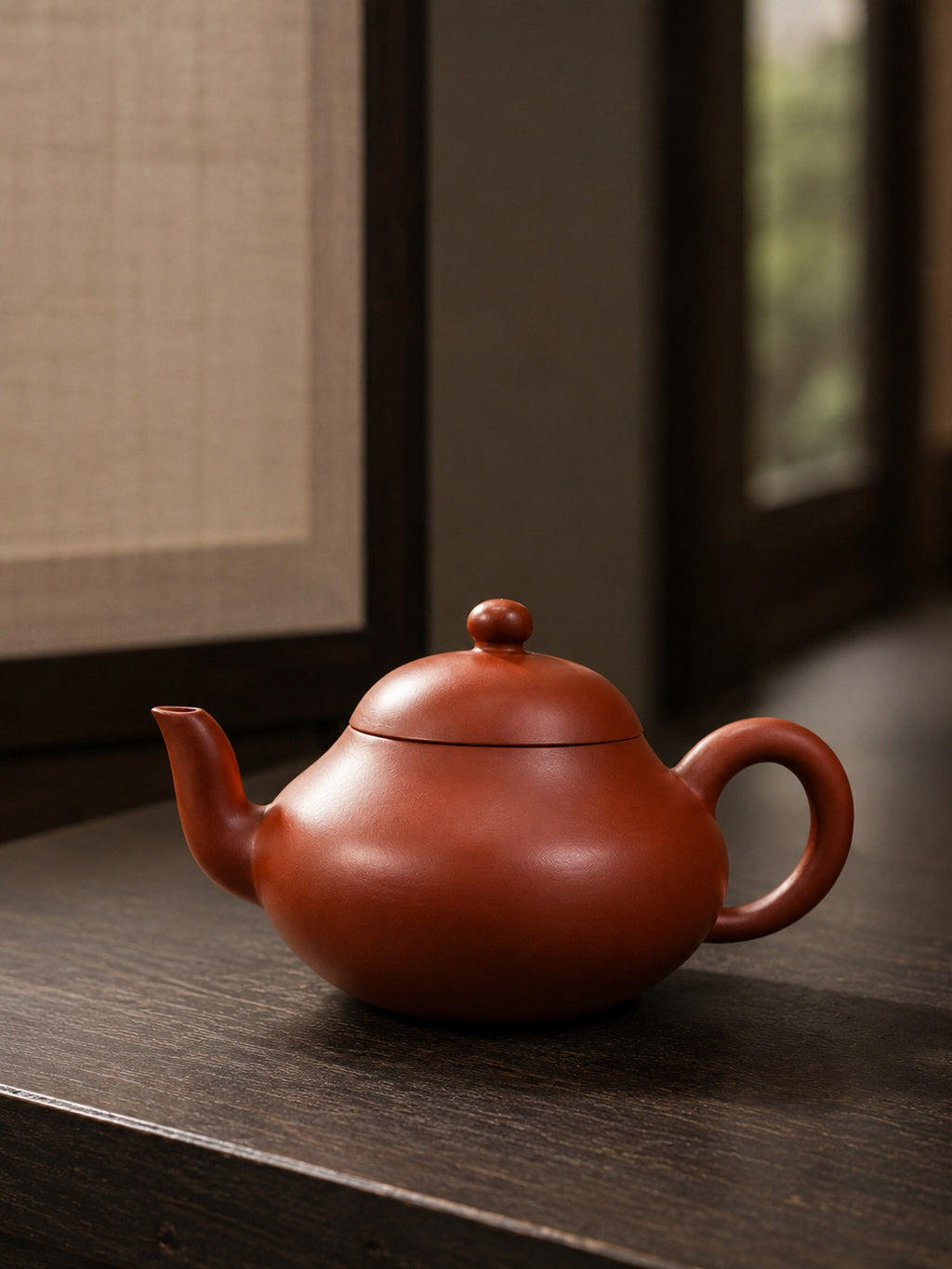 Aili teapot, full alternate side view beside a softly lit window