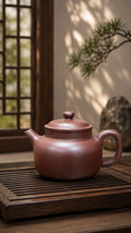 Dicaoqing Zini Dezhong teapot, full side view on a tea tray