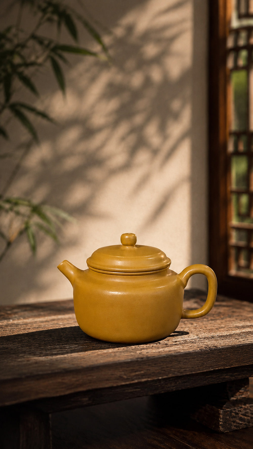 Dezhong Yixing teapot in golden Zhuni, left profile on a rustic table