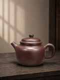 Dezhong teapot in Zipao Yusha Clay, full side view with a stepped lid and square loop handle