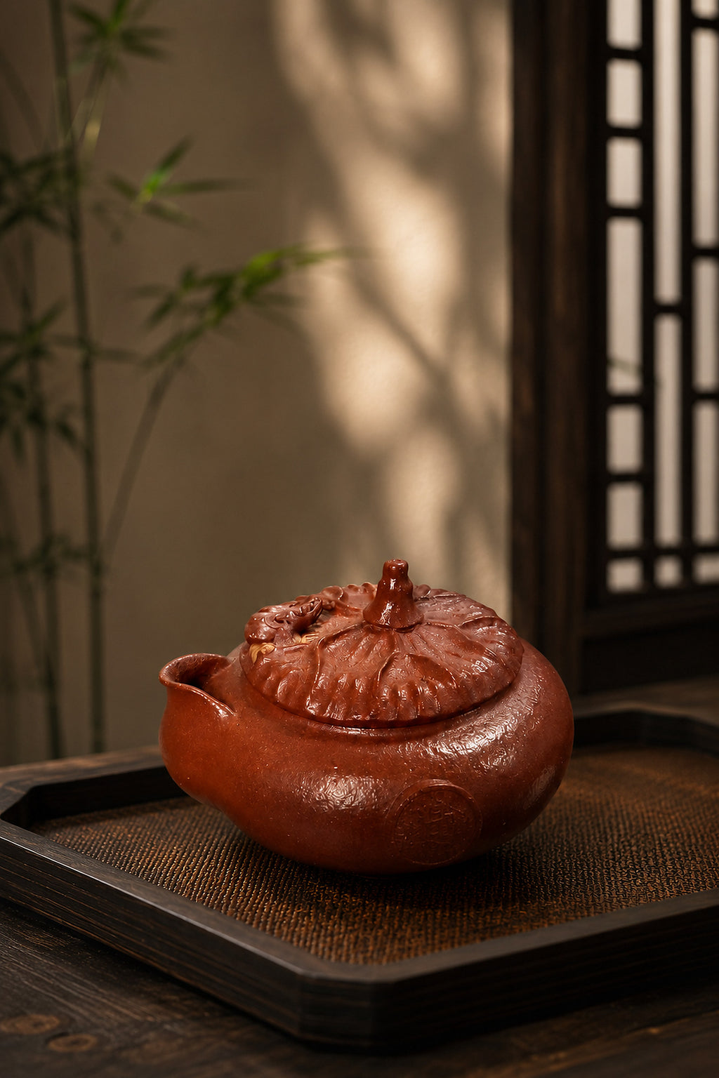 Hand-grip Yixing teapot in Jiangponi, front three-quarter view on a tea tray