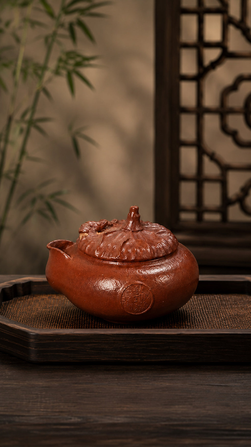 Hand-grip Yixing teapot in Jiangponi, front view on a rectangular tea tray