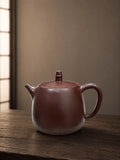Handuo teapot in Zipao Yusha Clay, full side view of the tall rounded body and upright lid knob