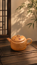 Hanwa Yixing teapot in golden Duanni, left profile with floral lid accents