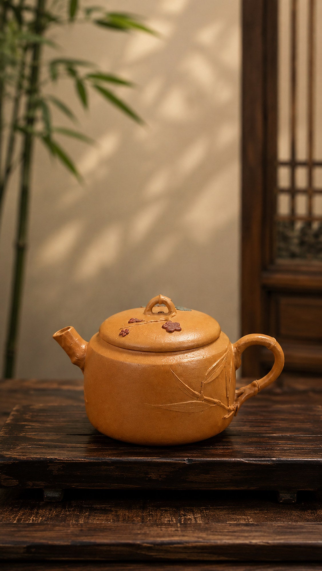 Hanwa Yixing teapot in golden Duanni, left profile on a wood table