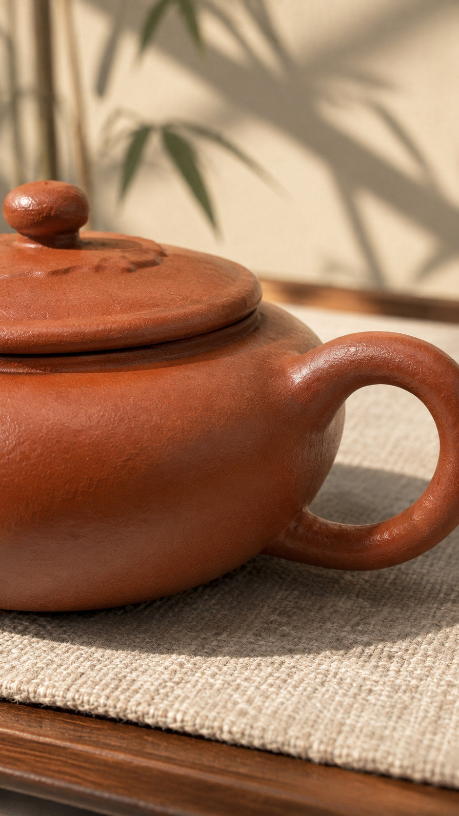 Lian Deng teapot, close-up of the loop handle and textured clay surface