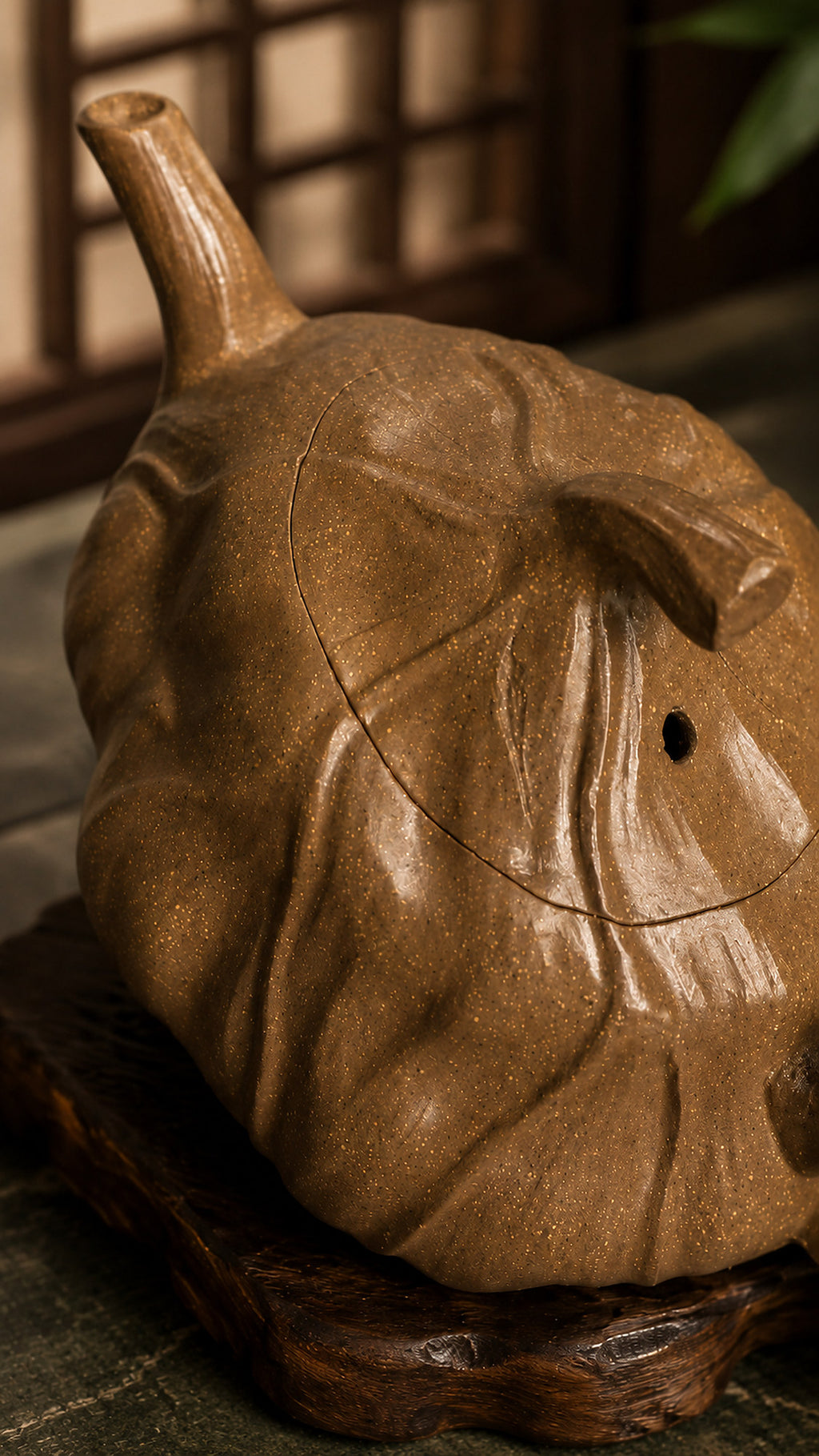 Lotus-form Yixing teapot in aged Duanni, rear three-quarter close-up of textured body