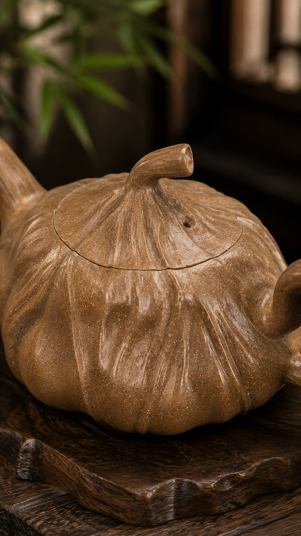 Lotus-form Yixing teapot in aged Duanni, close-up of lid and sculpted surface