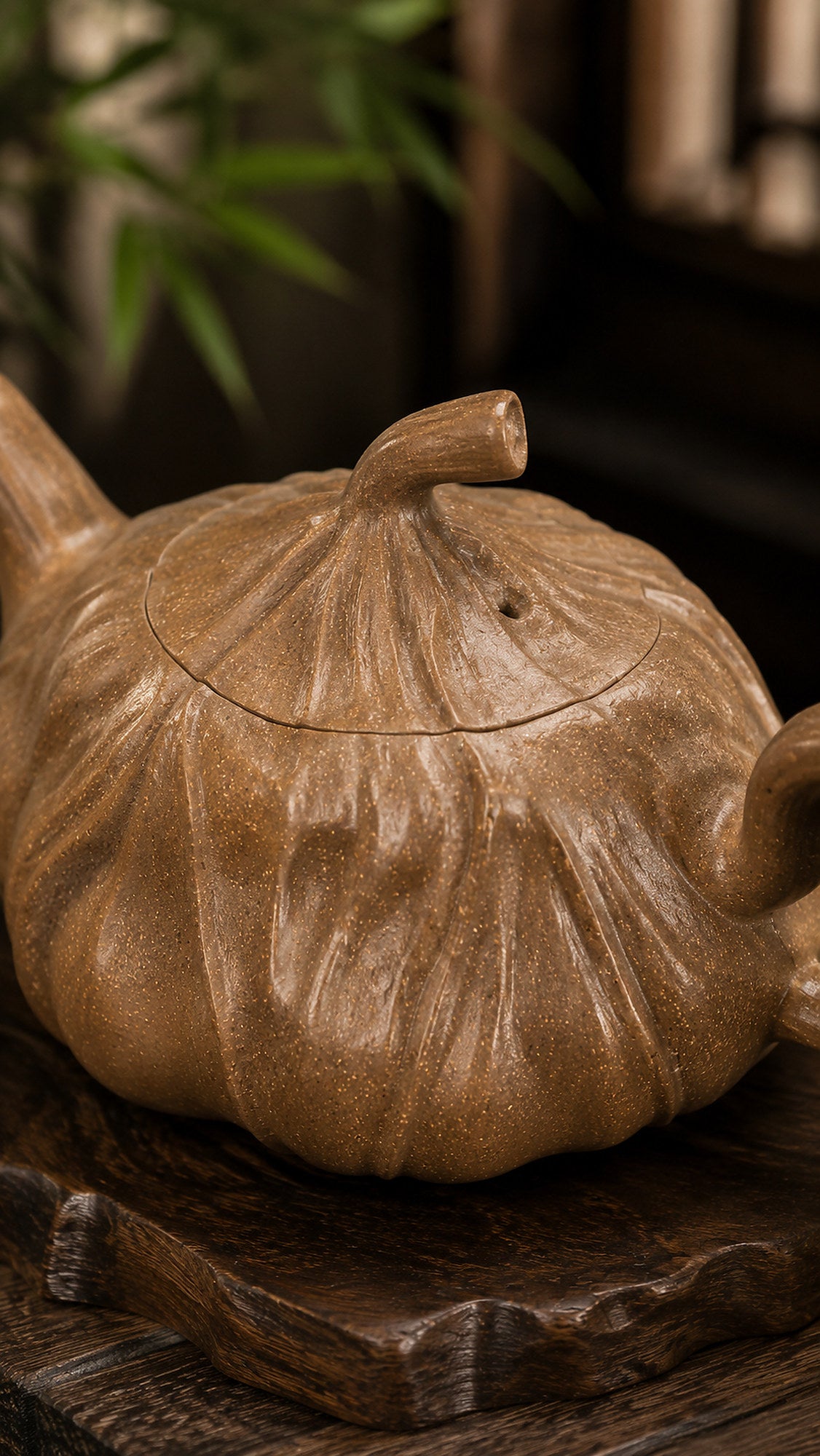 Lotus-form Yixing teapot in aged Duanni, close-up of lid and sculpted surface