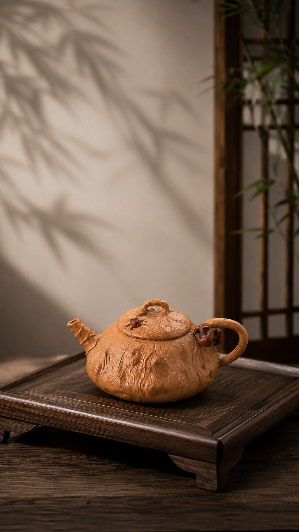 Lotus-form Yixing teapot in aged Duanni, wide left profile on a wood stand