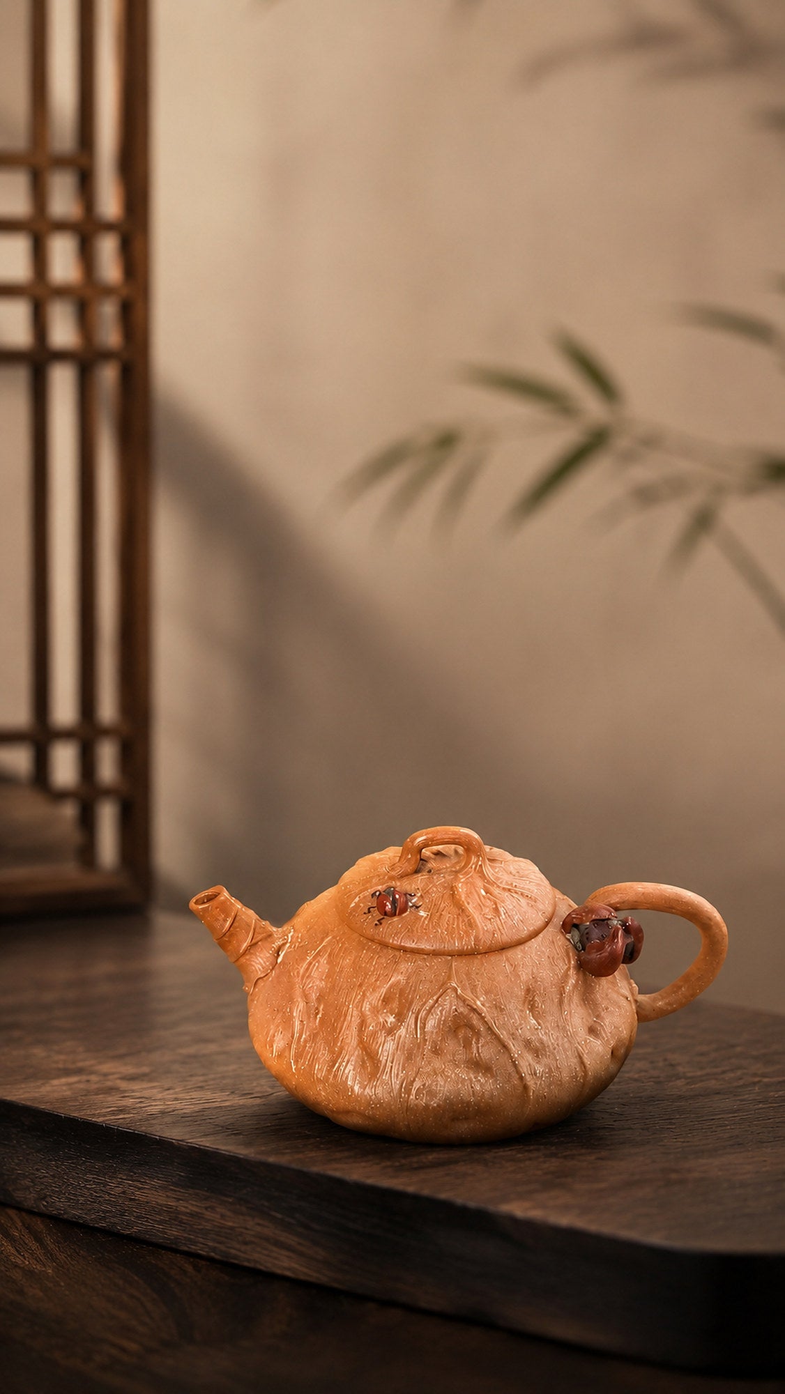 Lotus-form Yixing teapot in aged Duanni, left profile in warm window light