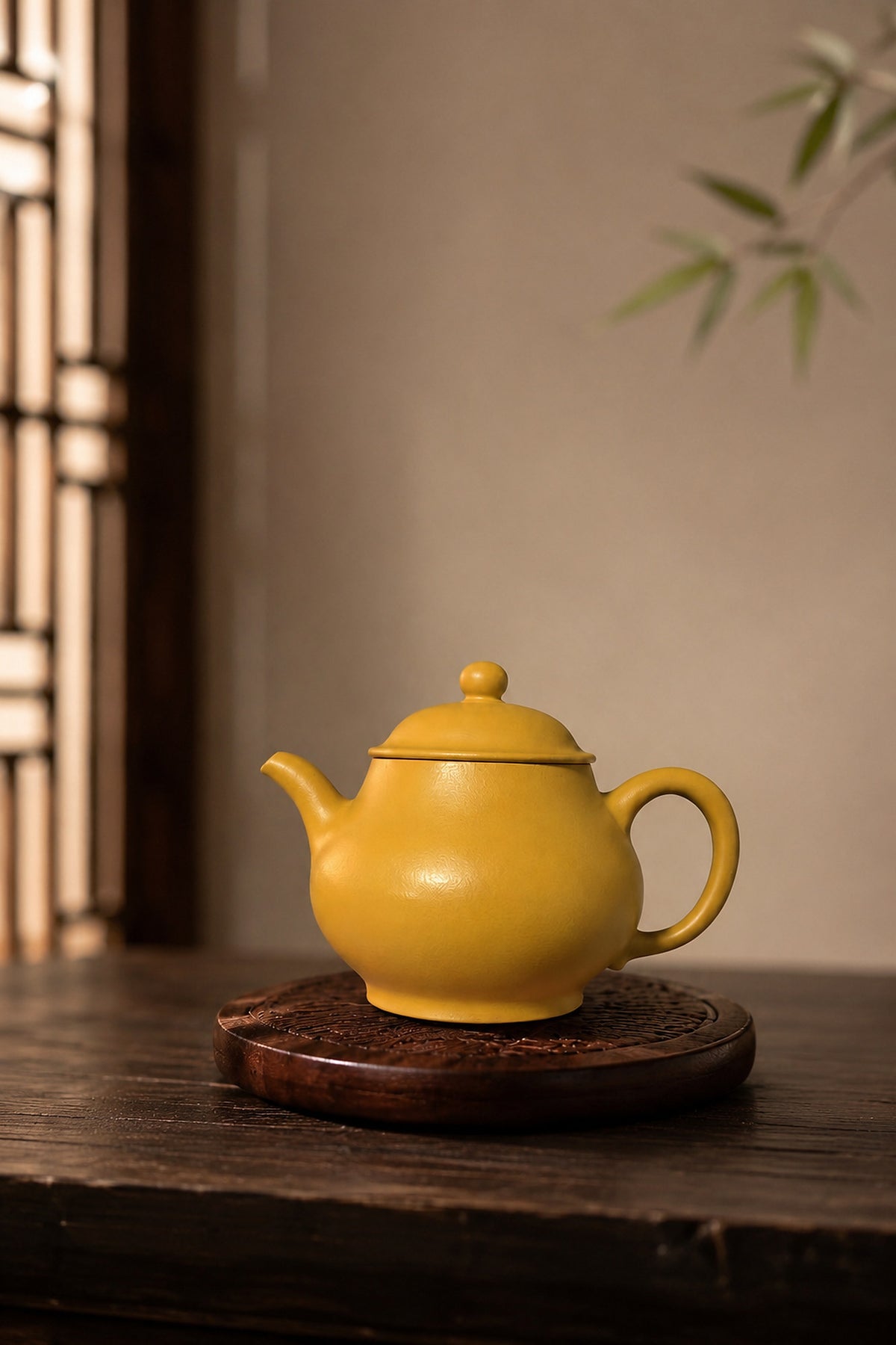 Pan Hu Yixing teapot in golden Zhuni, left profile on a round wooden stand