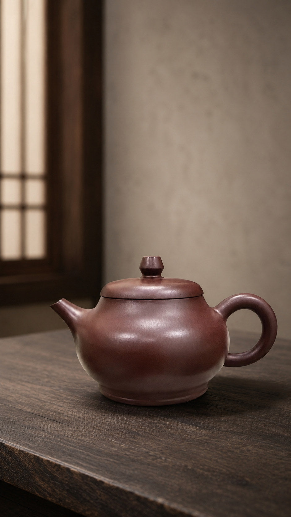 Pan Hu teapot in Zipao Yusha Clay, full side view of the rounded belly and raised foot