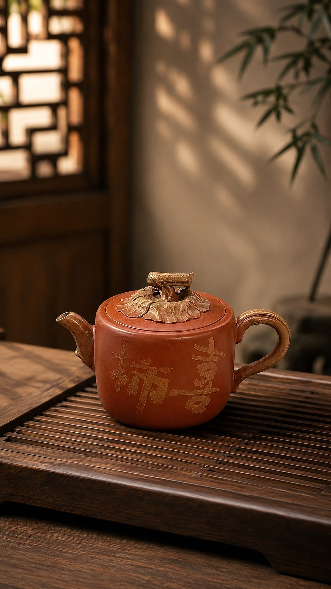 Persimmon-form Yixing teapot in aged Duanni, front view on a slatted tea tray