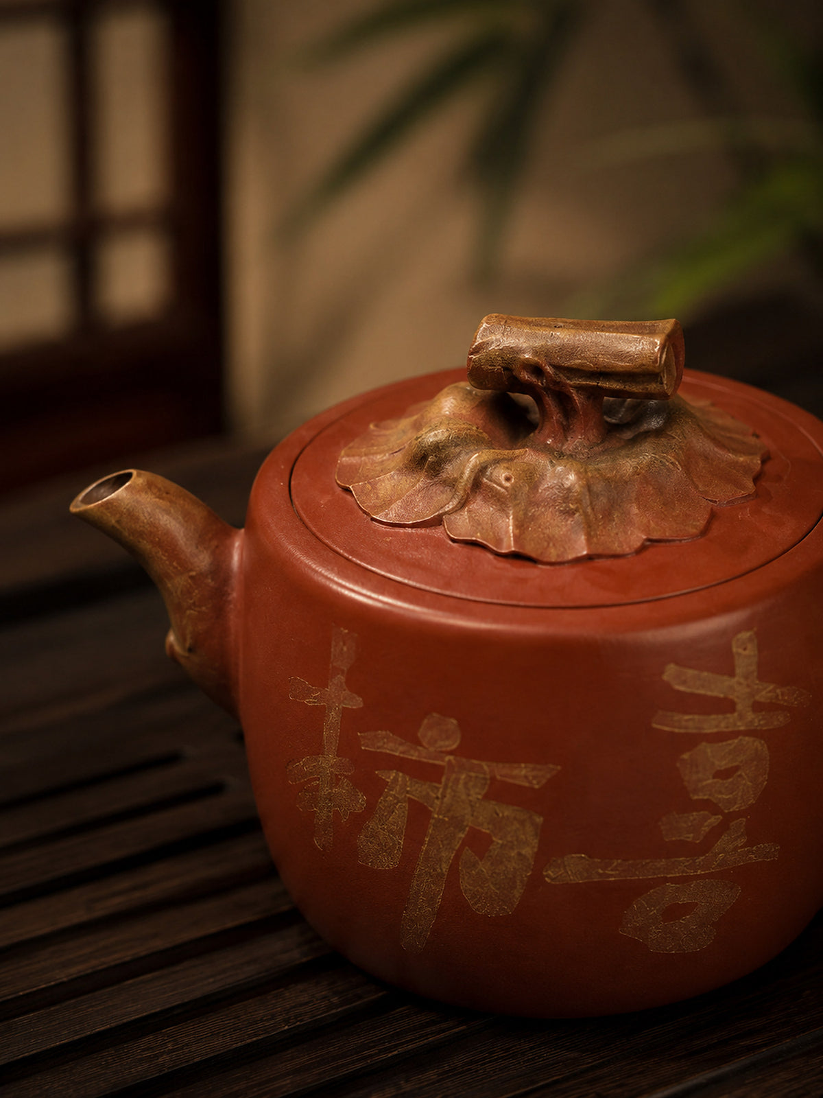Persimmon-form Yixing teapot in aged Duanni, close-up of spout and sculpted lid