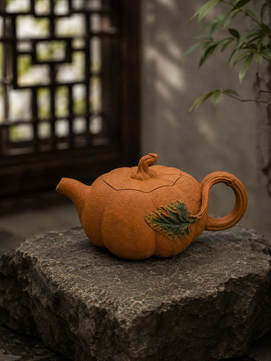 Pumpkin-form Yixing teapot in golden Duanni, left profile on a rough stone block