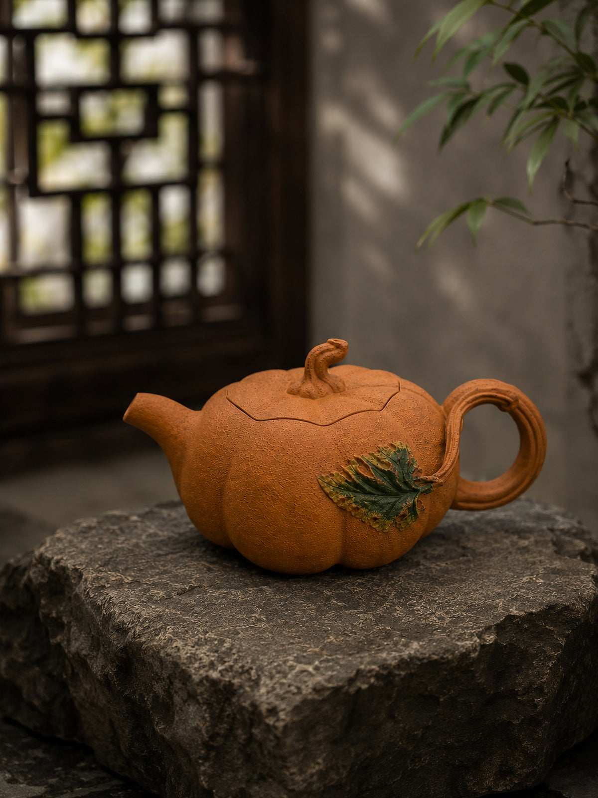 Pumpkin-form Yixing teapot in golden Duanni, left profile on a rough stone block