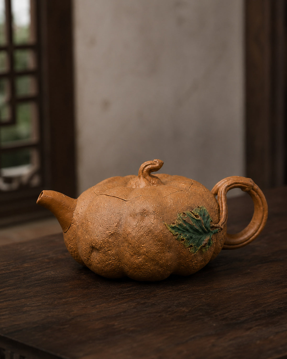 Pumpkin-form Yixing teapot in golden Duanni, close profile on a wood tabletop