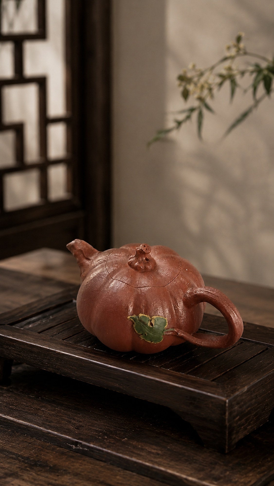 Pumpkin-form Yixing teapot in Jiangponi, profile on a dark wood platform