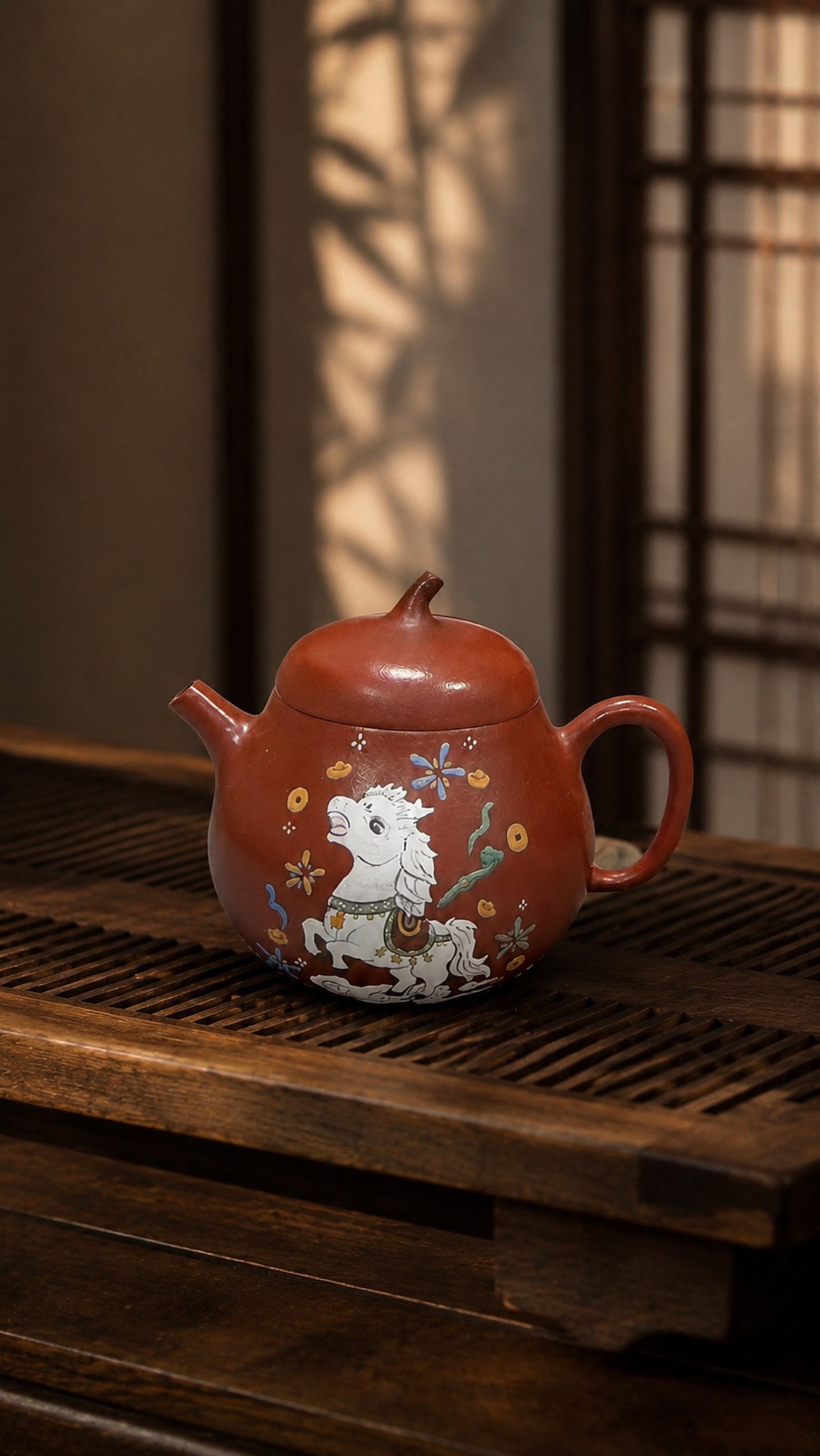 Zhuni Qie Gua teapot with horse artwork on a tea tray