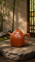 Red Jiangponi Qinquan teapot with open-loop lid handle