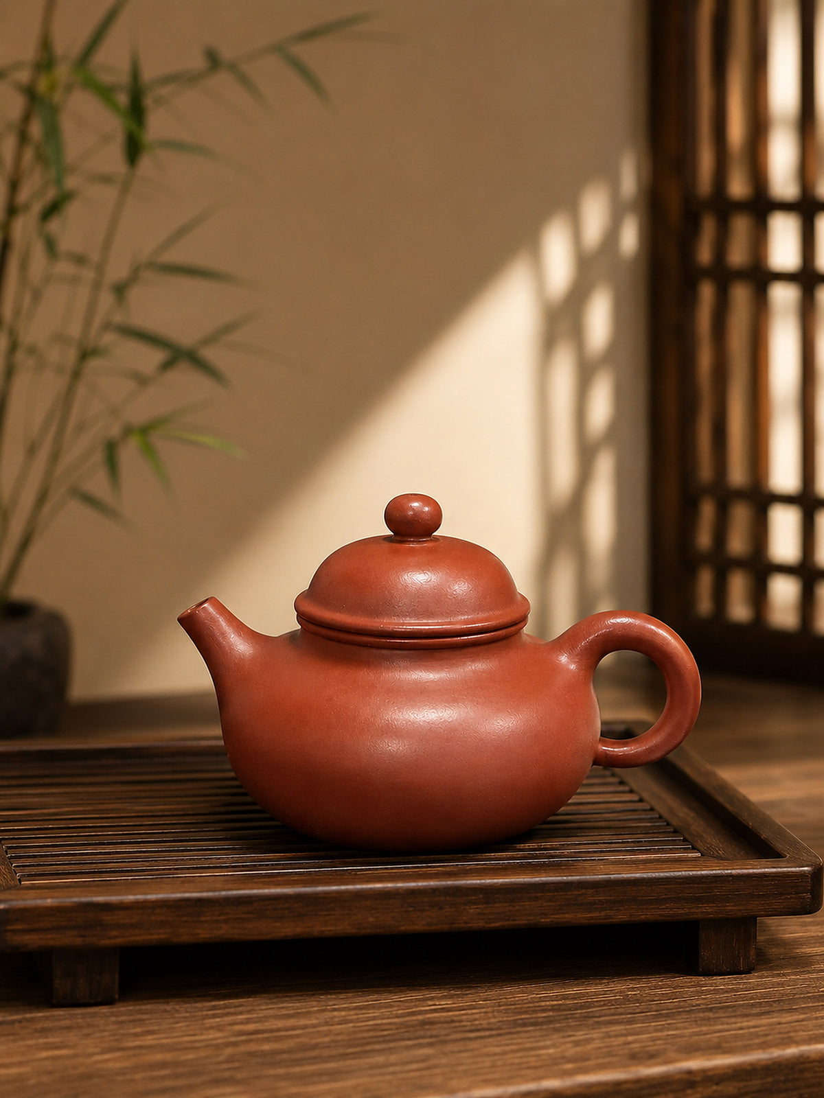 Rongtian Yixing teapot in Zhuni clay on a wooden tea tray