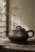Ziyu Jinsha Shipiao teapot with carved bamboo leaves