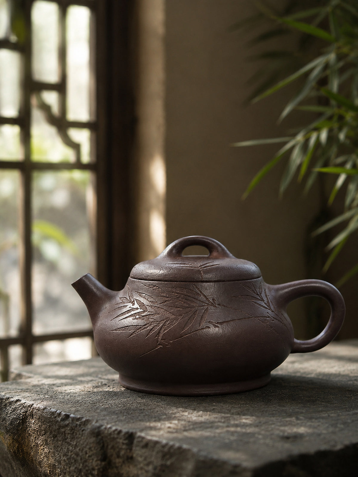 Ziyu Jinsha Shipiao teapot displayed on gray stone