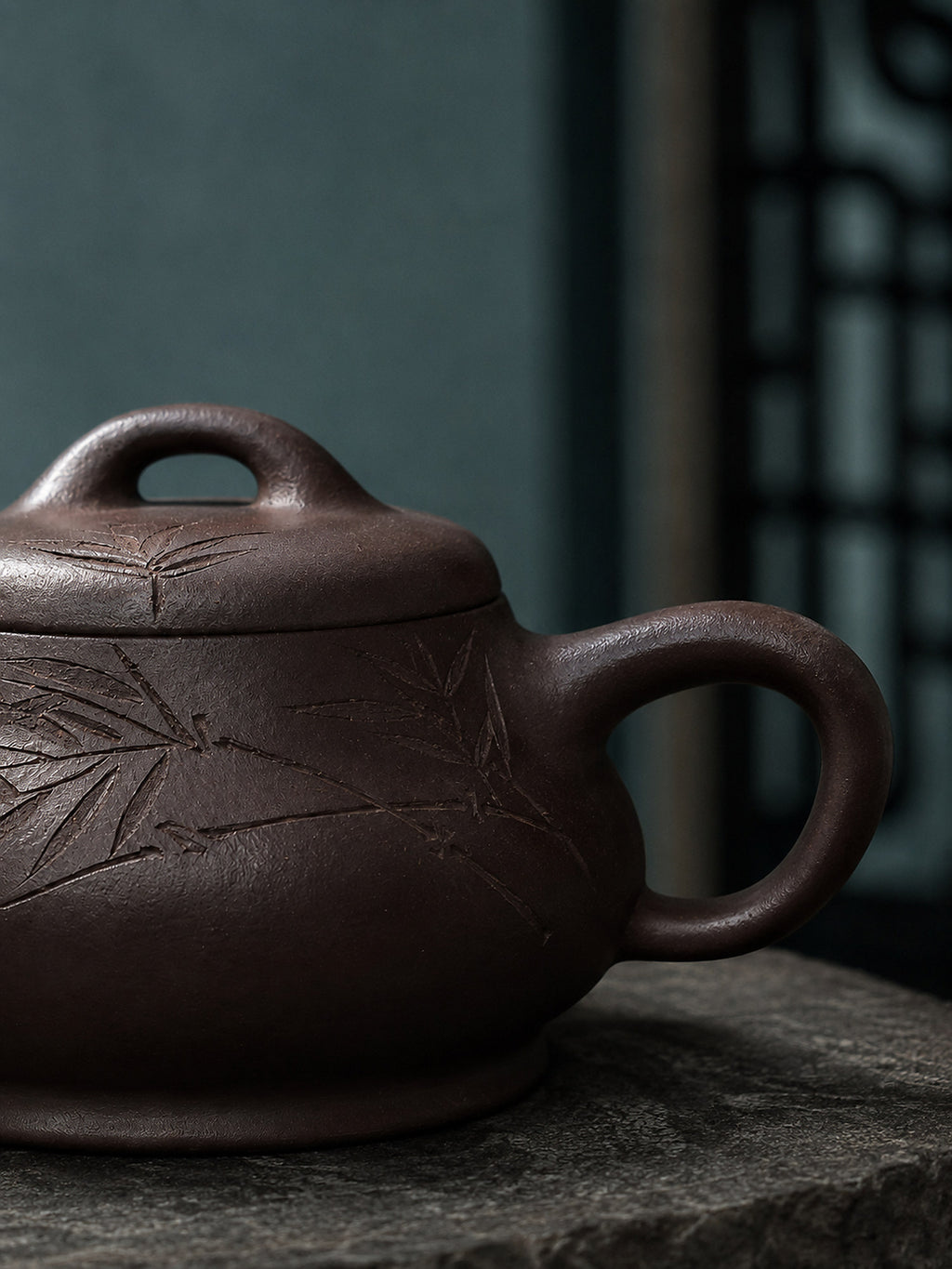 Ziyu Jinsha Shipiao teapot carving and loop handle close-up