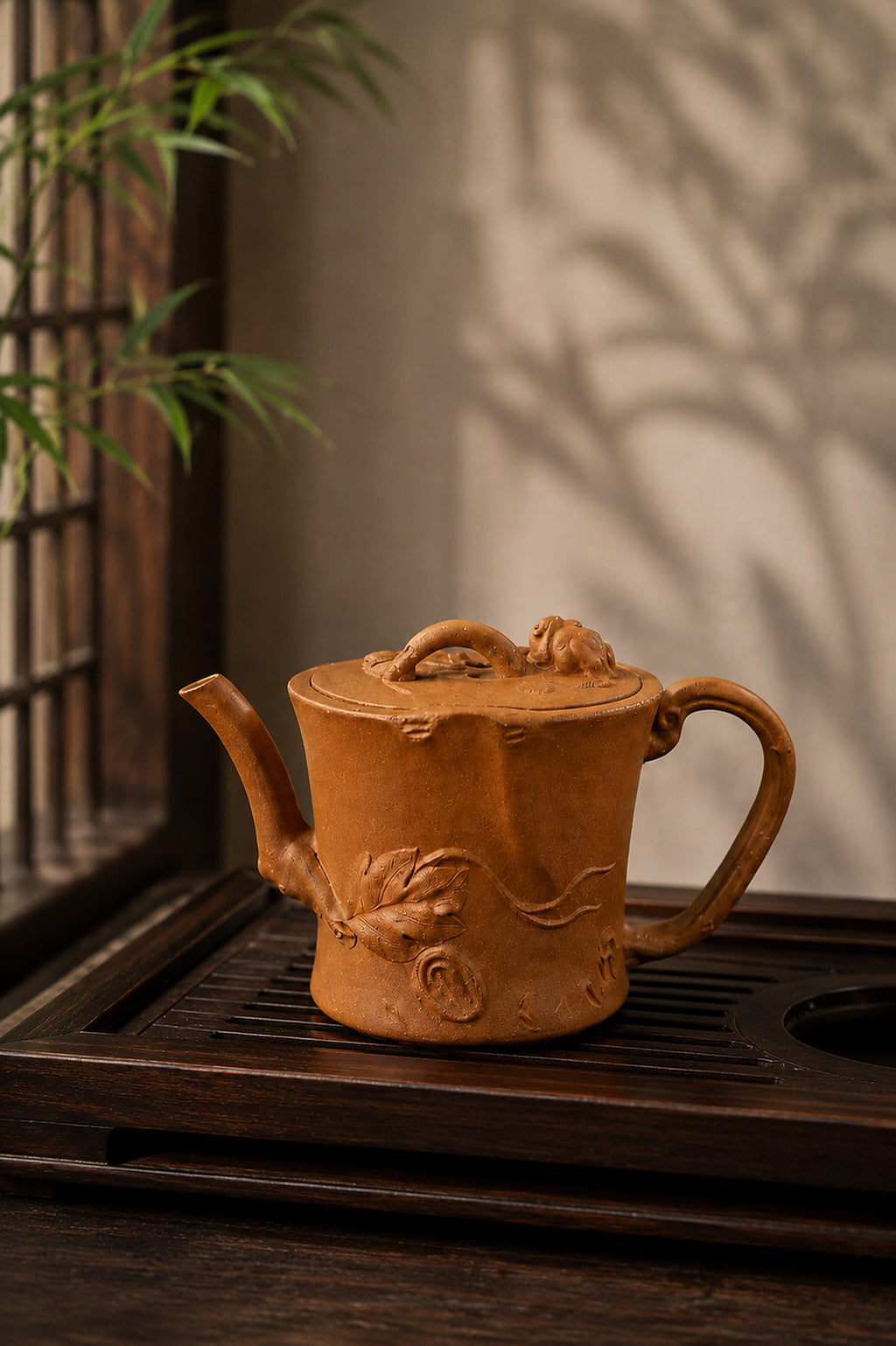 Tree-trunk-form Yixing teapot in yellow Jiangponi, left profile on a slatted tea tray