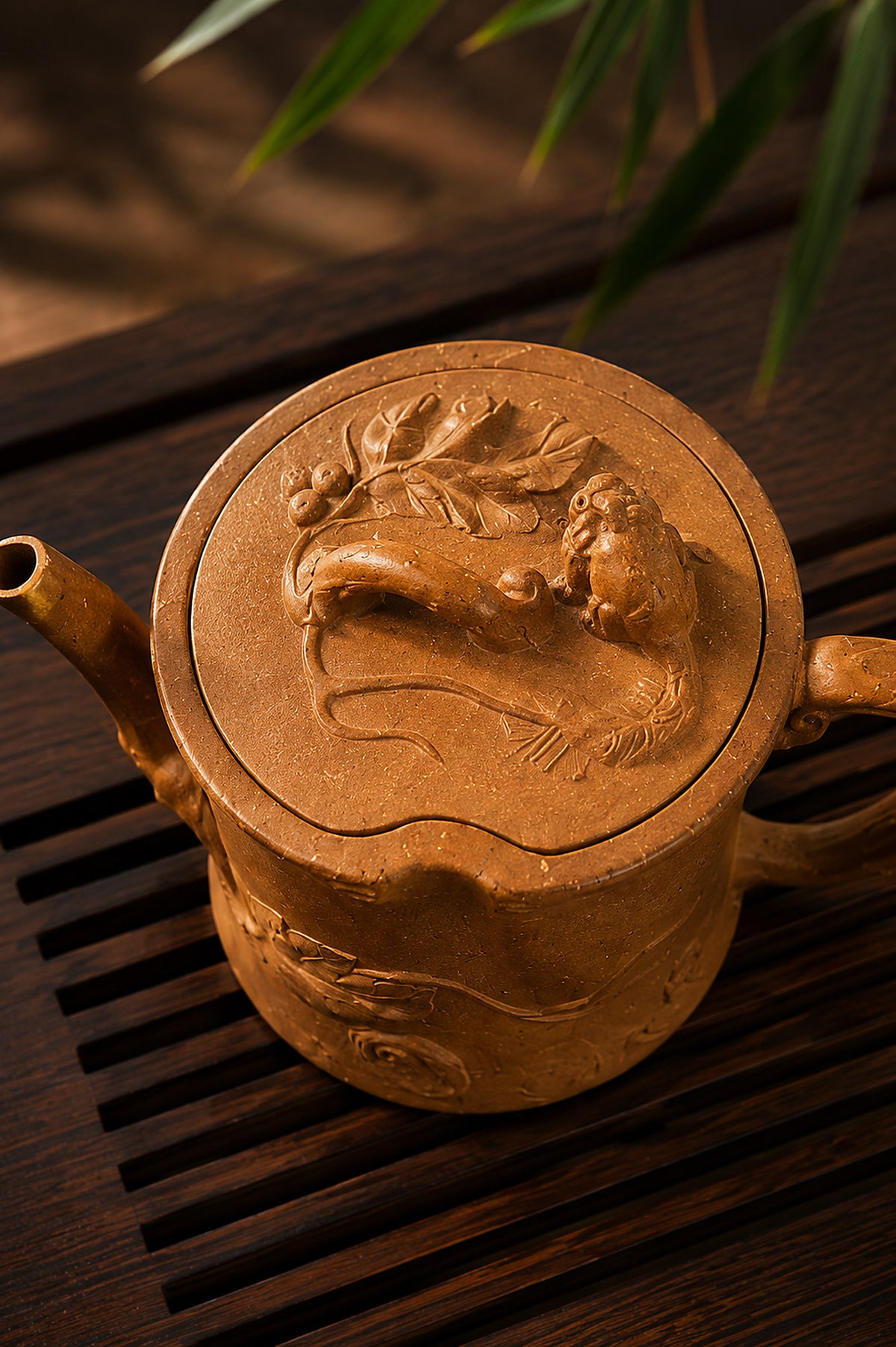 Tree-trunk-form Yixing teapot in yellow Jiangponi, top view of sculpted lid motif