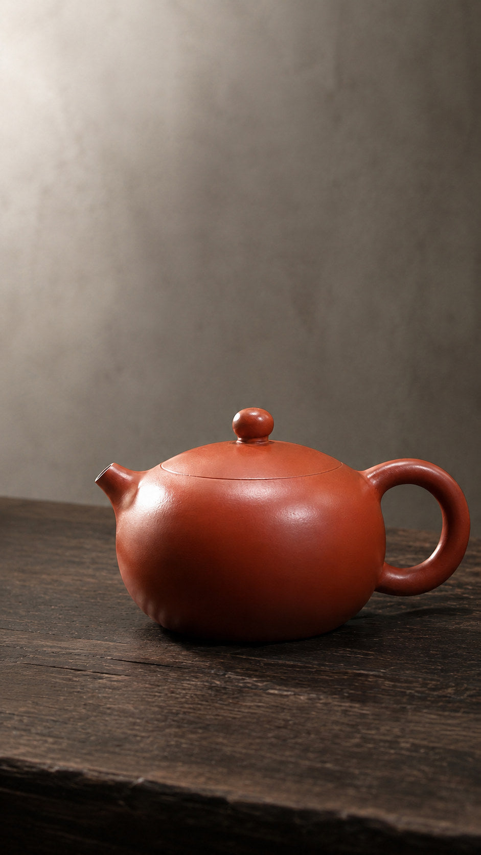 Xishi teapot, wide alternate side view in soft window light