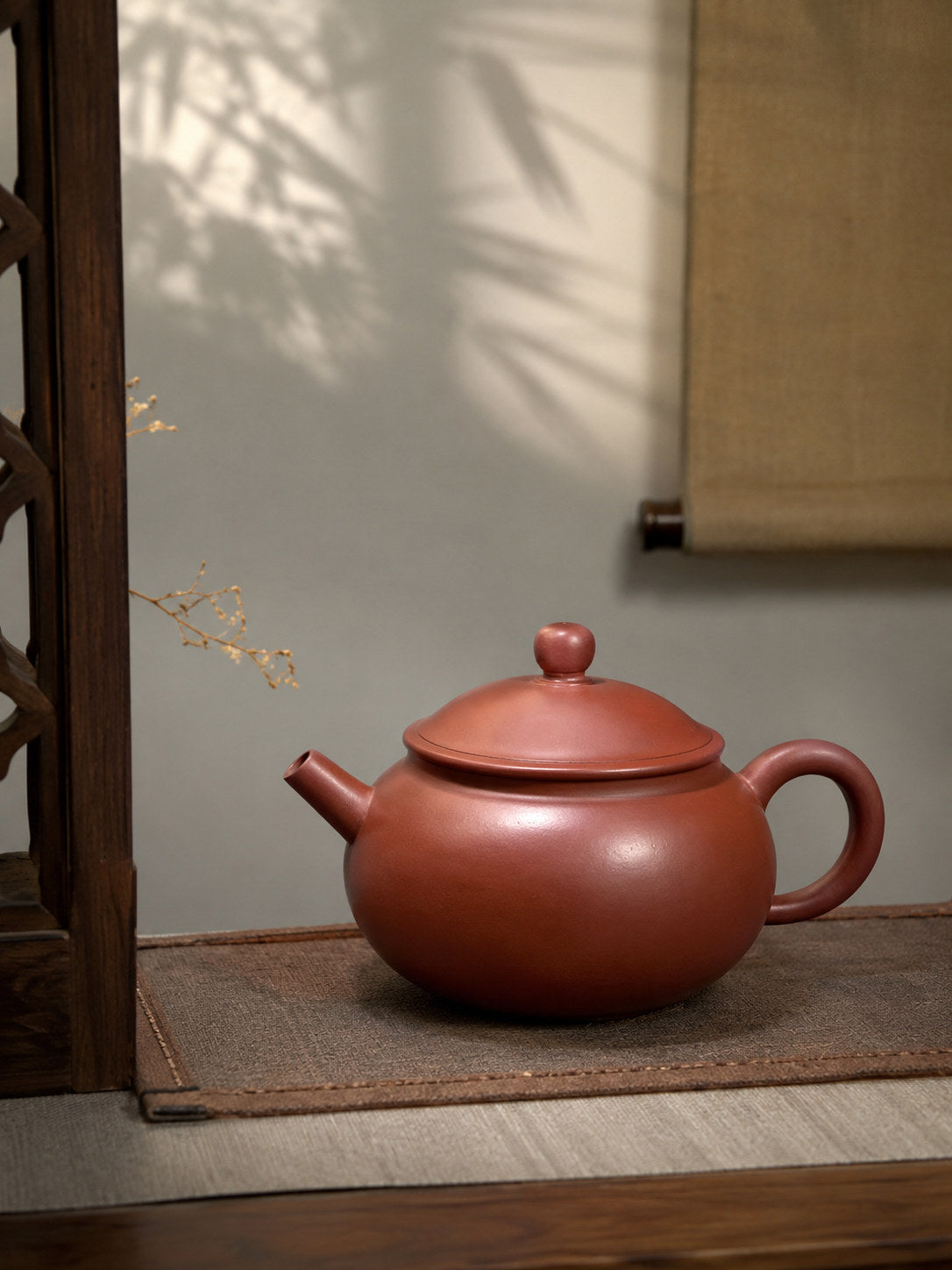Yuan Bao teapot, wide side view in a softly lit tea alcove