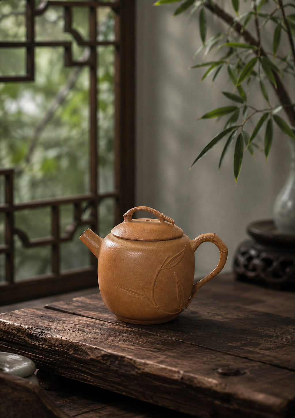 Yuan Zhu Yixing teapot in golden Duanni, left profile on a rustic wood table