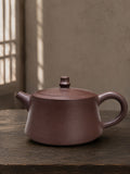 Zhu Chu teapot in Zipao Yusha Clay, full side view of the low flared body and flat lid
